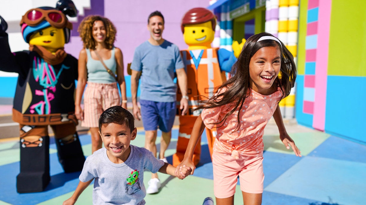 Family enjoying time with LEGO characters at LEGOLAND® California.