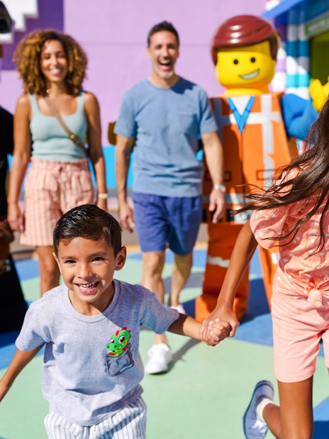 Family enjoying time with LEGO characters at LEGOLAND® California.