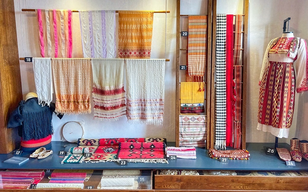Traditional Albanian textiles and garments on display in the ethnographic museum at Kruja Castle, Albania.
