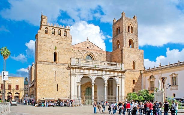 Monreale Cathedral facade with tourists, shuttle service Monreale to Palermo.