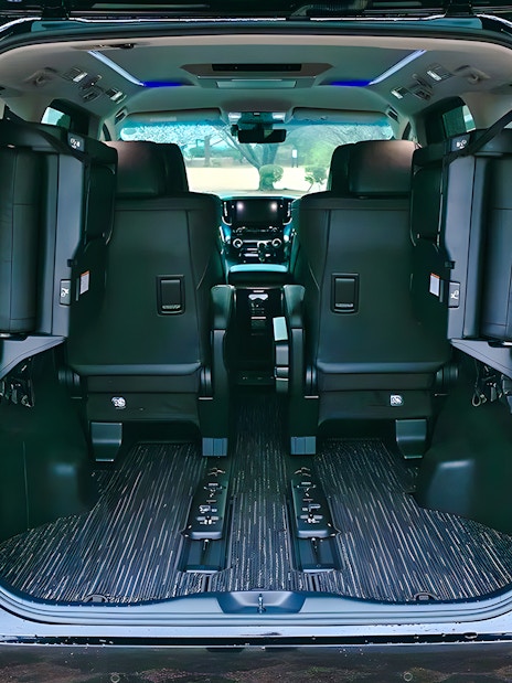 Interior view of a spacious private car for airport transfer.