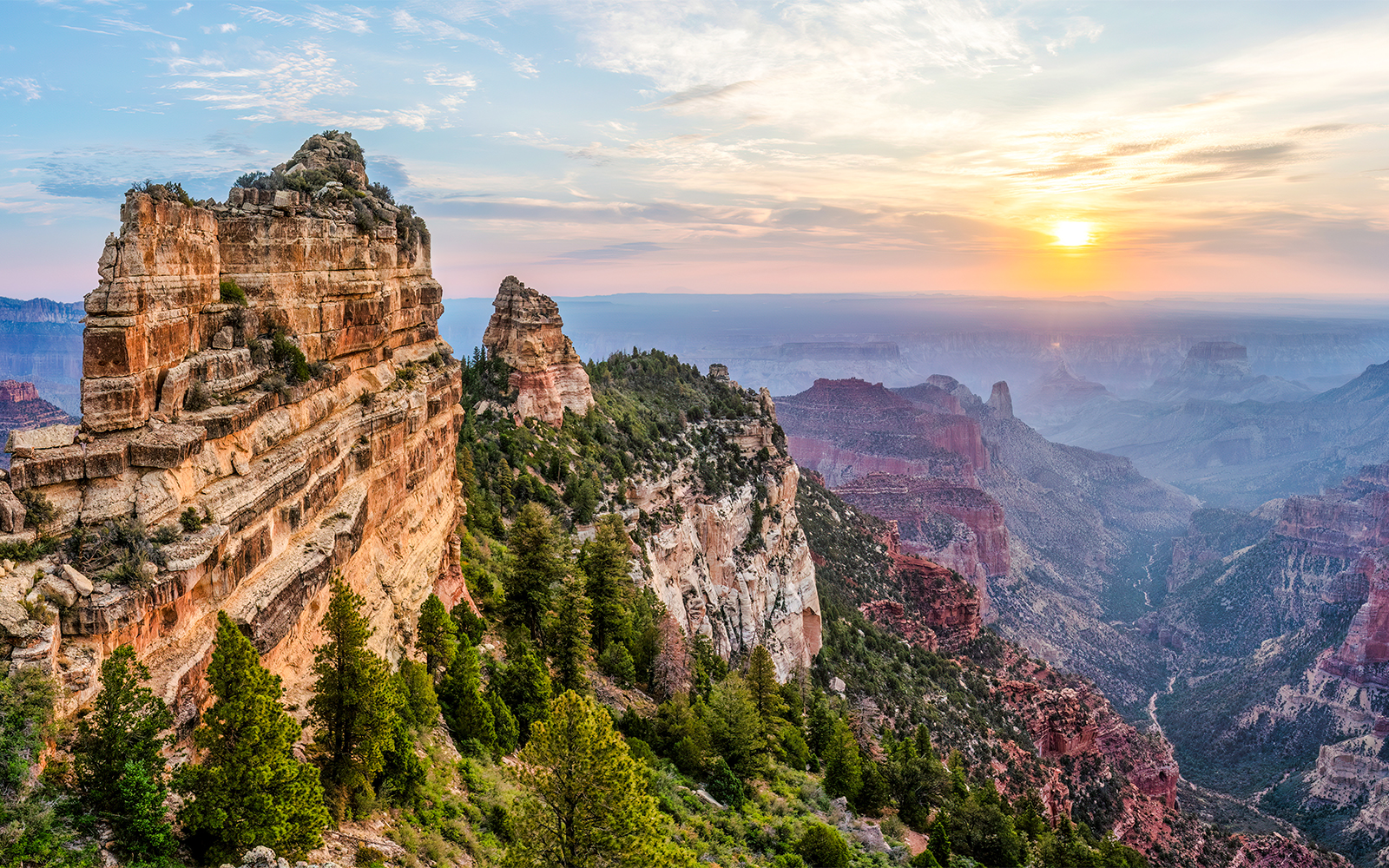 Sunrise view at Roosevelt Point Overlook, Grand Canyon, with expansive canyon landscape.