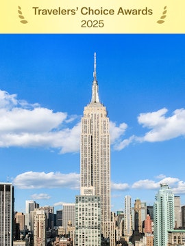 Empire State Building under a clear blue sky in Manhattan, NYC.