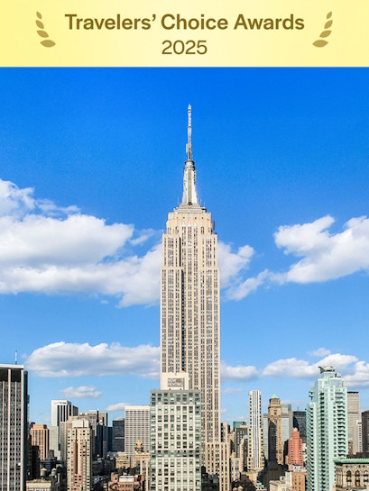 Empire State Building under a clear blue sky in Manhattan, NYC.