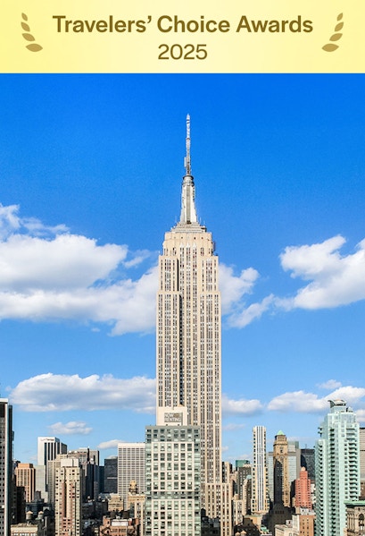 Empire State Building under a clear blue sky in Manhattan, NYC.
