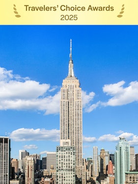 Empire State Building under a clear blue sky in Manhattan, NYC.