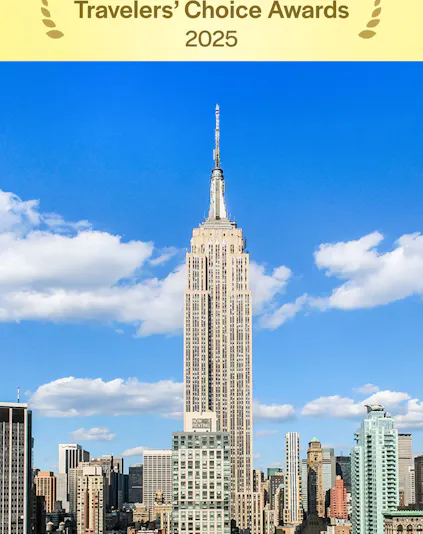 Empire State Building under a clear blue sky in Manhattan, NYC.