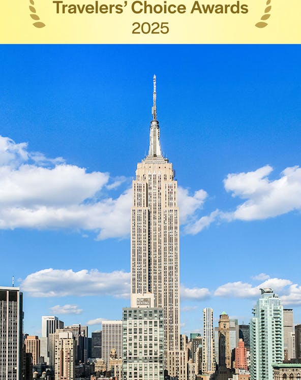 Empire State Building under a clear blue sky in Manhattan, NYC.
