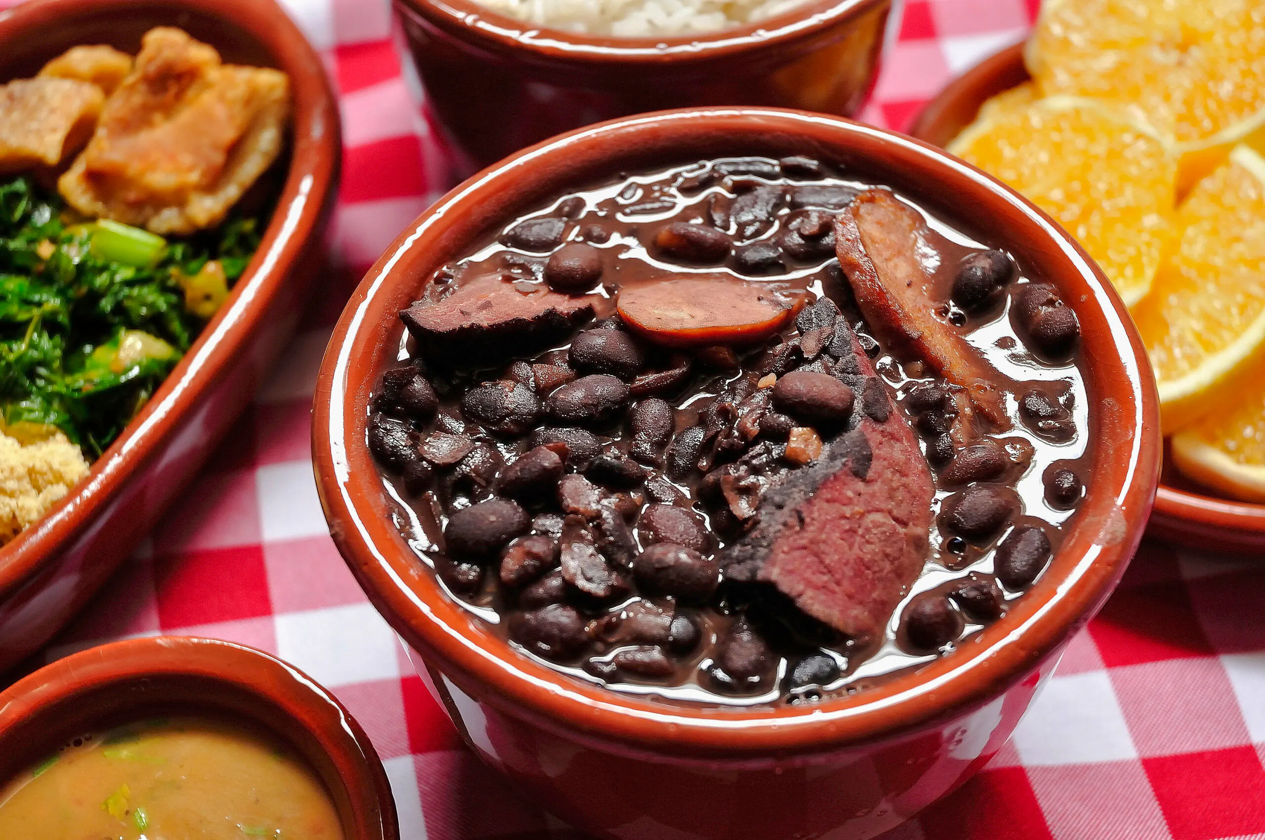 Feijoada dish with black beans and meat, part of Rio de Janeiro food tour.