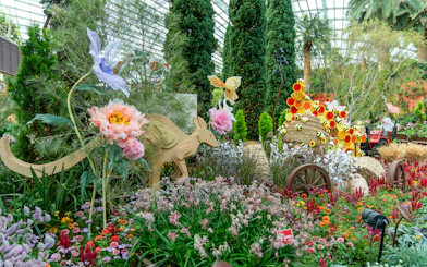 Gardens by the Bay floral display with wooden kangaroo and colorful flowers.