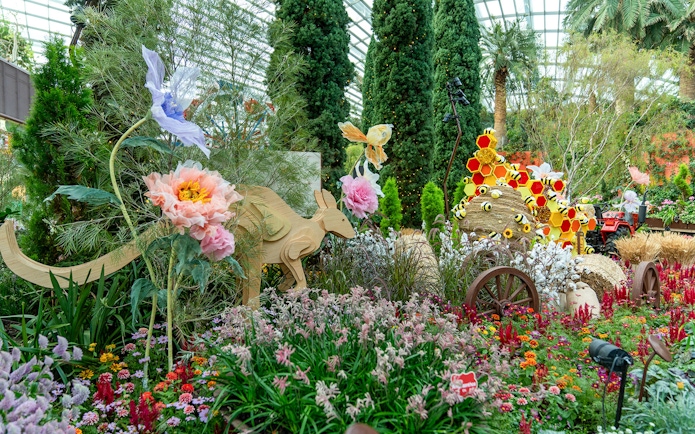 Gardens by the Bay floral display with wooden kangaroo and colorful flowers.
