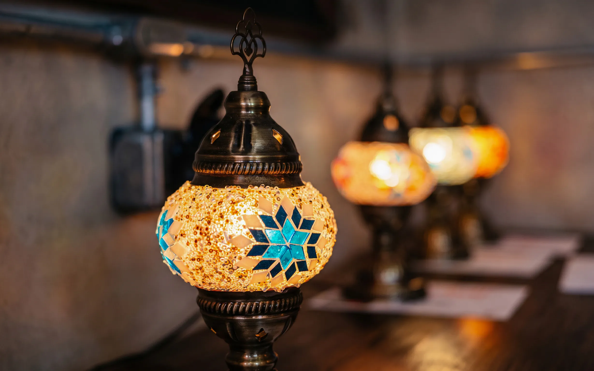 Turkish mosaic lamp with blue star pattern in Istanbul workshop.