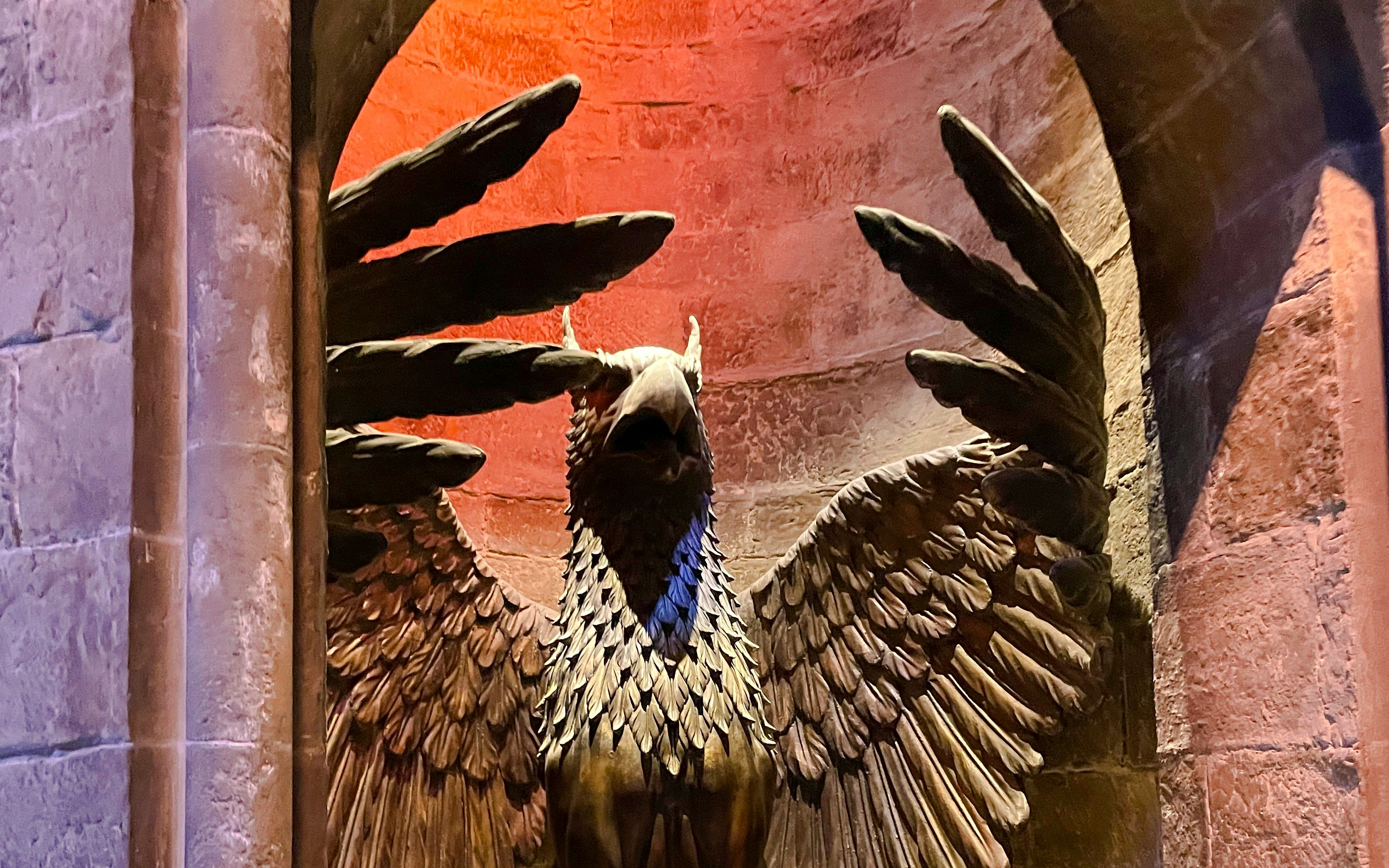 Stone griffin statue at entrance to Professor Dumbledore’s Office, detailed wings and beak.