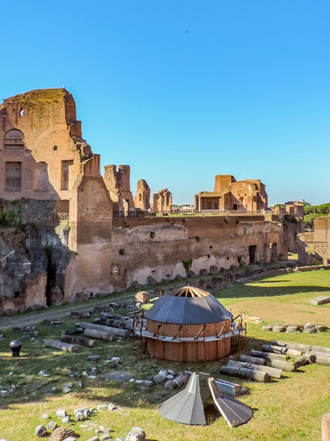 Colosseum Underground tour with views of Palatine Hill ruins on a sunny day in Rome, Italy.