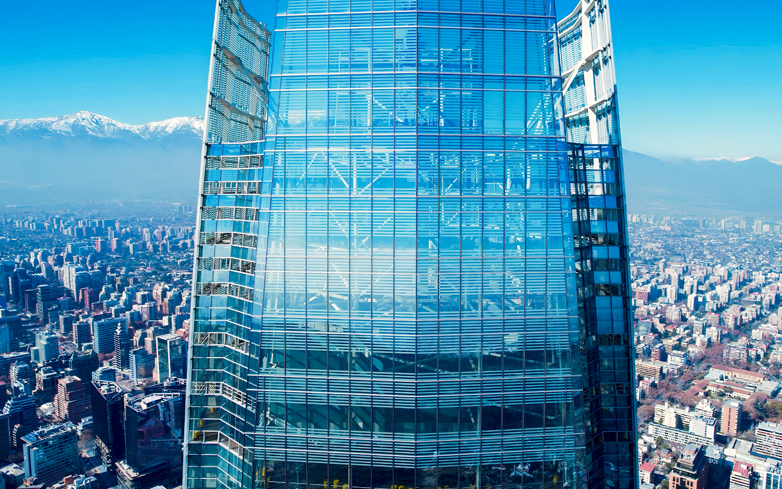 Costanera Sky skyscraper with Santiago cityscape and Andes mountains in the background, Chile.