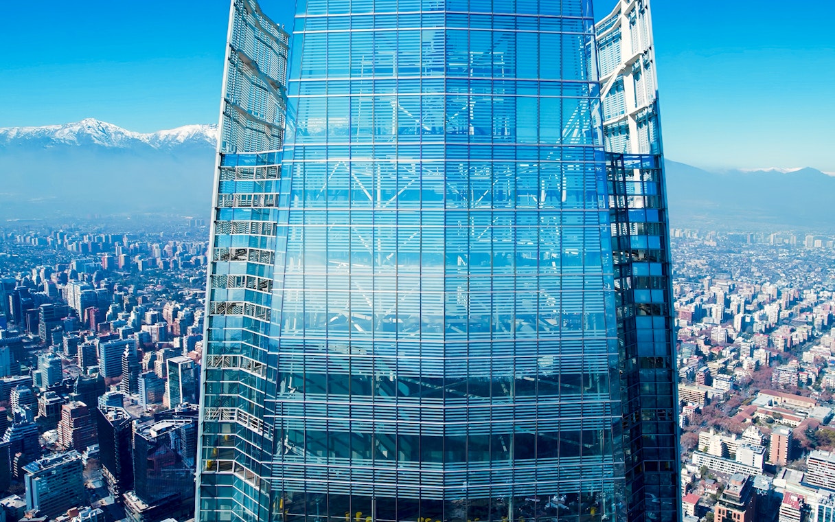 Costanera Sky skyscraper with Santiago cityscape and Andes mountains in the background, Chile.