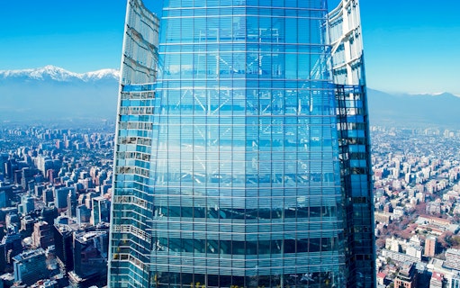 Costanera Sky skyscraper with Santiago cityscape and Andes mountains in the background, Chile.