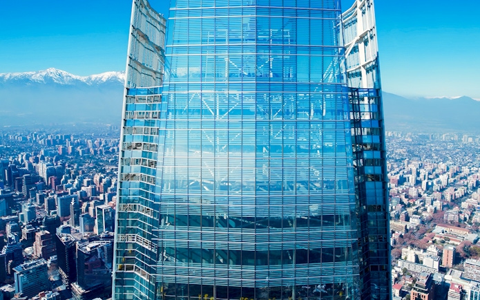 Costanera Sky skyscraper with Santiago cityscape and Andes mountains in the background, Chile.