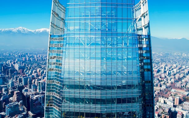 Costanera Sky skyscraper with Santiago cityscape and Andes mountains in the background, Chile.
