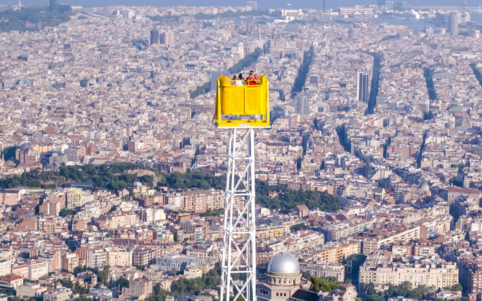 Talaia ride overlooking Barcelona cityscape from Tibidabo Amusement Park.