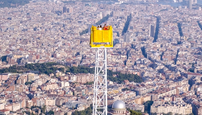 Talaia ride overlooking Barcelona cityscape from Tibidabo Amusement Park.