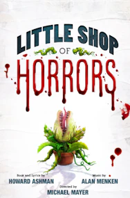 Audrey II plant puppet on stage during Little Shop Of Horrors performance.