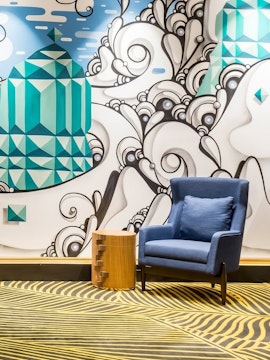 Colorful mural and seating area at Plaza Premium Lounge, Rio de Janeiro Airport, T2.