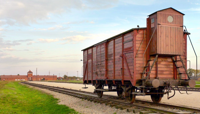 Railway wagon on tracks leading to Auschwitz-Birkenau, Poland.