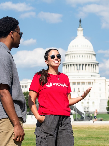 Tour group discussing in front of the U.S. Capitol on Washington DC Monuments and Memorials Electric Cart Tour.