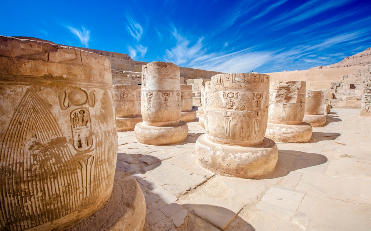 Carved columns with hieroglyphs at Karnak Temple, Luxor, Egypt.
