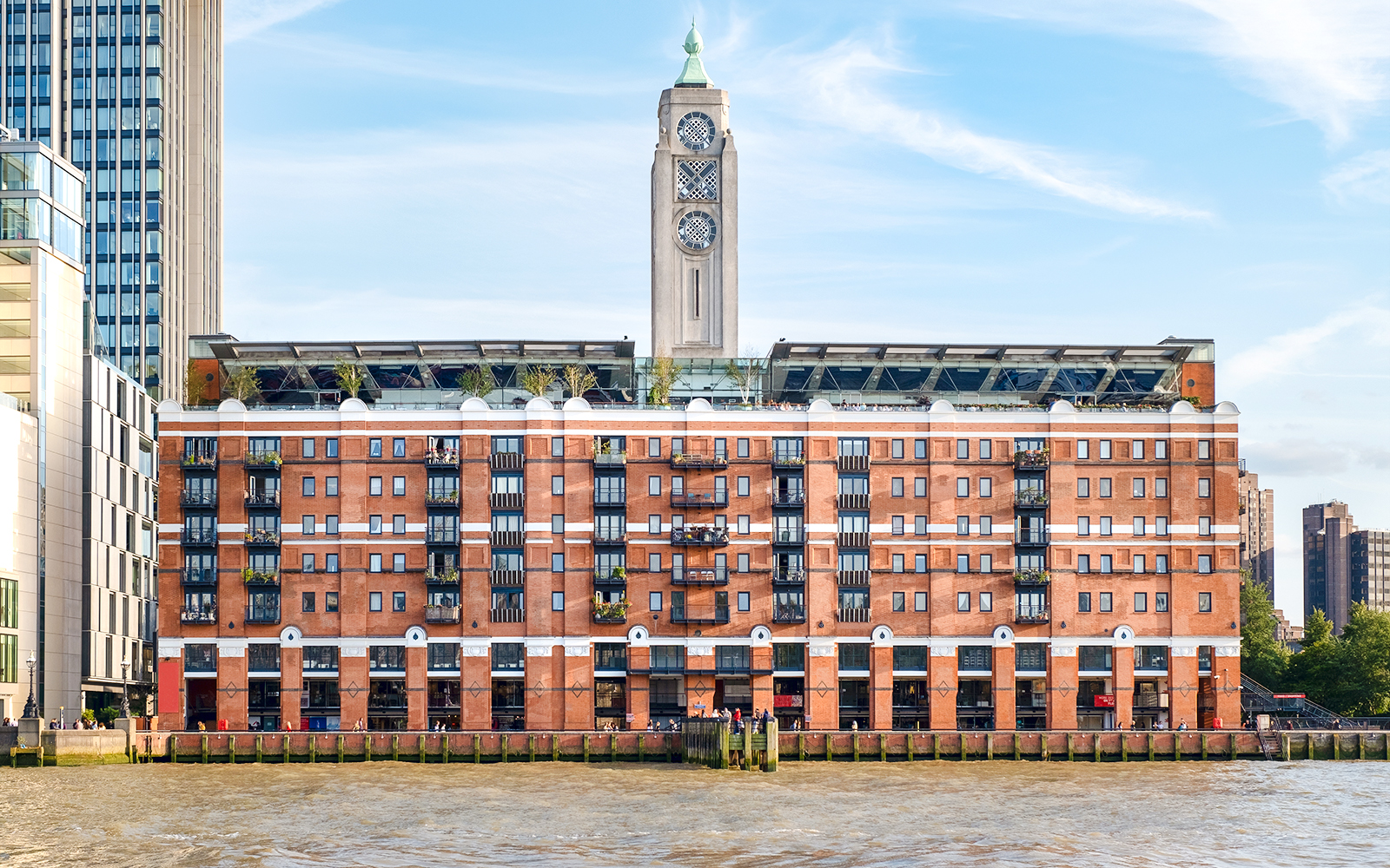OXO Tower on the Thames River in London, featuring its iconic tower and riverside view.
