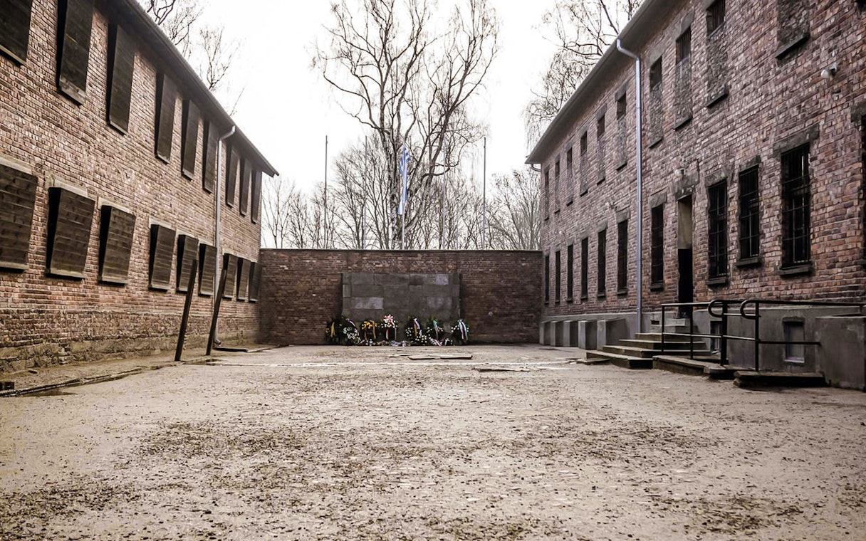 Courtyard with memorial wreaths at Auschwitz concentration camp, Poland.