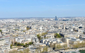 Paris cityscape view from the Eiffel Tower, featuring the Arc de Triomphe, Paris, France.
