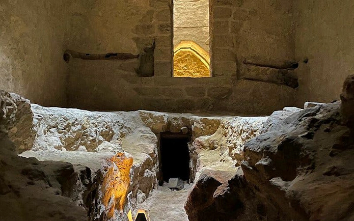 Underground stone hamam interior with arched window in Baku, Azerbaijan.