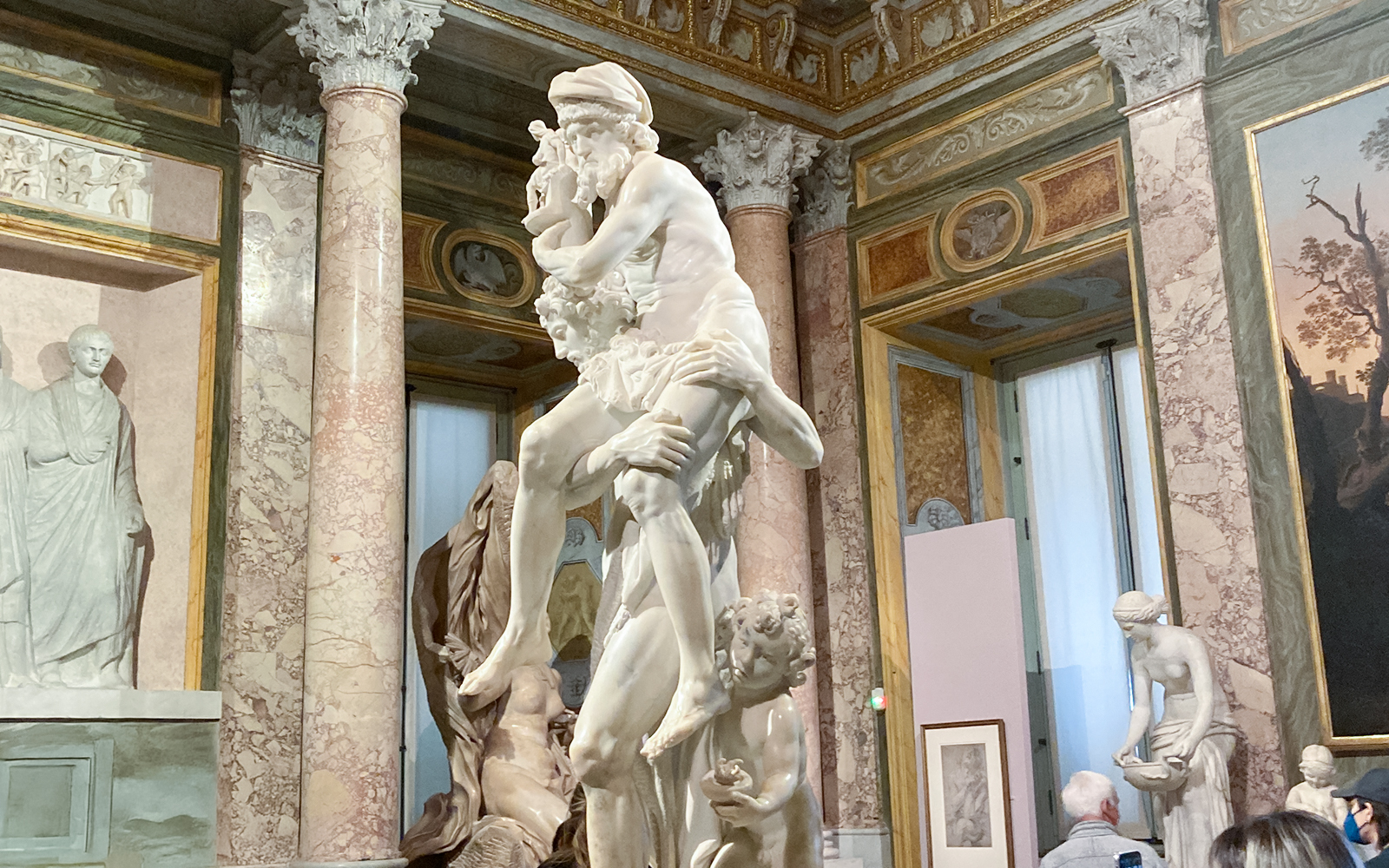 Gian Lorenzo Bernini's sculpture of Aeneas, Anchises, and Ascanius in a museum setting.