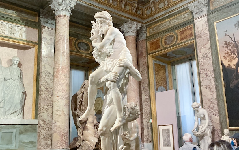 Gian Lorenzo Bernini's sculpture of Aeneas, Anchises, and Ascanius in a museum setting.