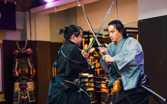 Samurai swordplay demonstration in Tokyo dojo.