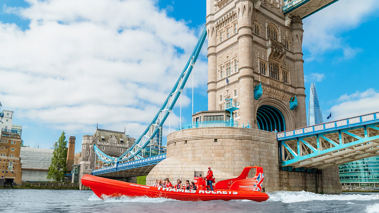 Speed boat on the Thames River near Tower Bridge, London.
