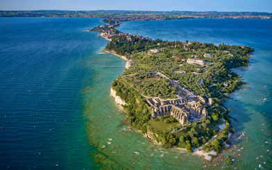 Aerial view of Grotto of Catullus ruins on Sirmione peninsula, Lake Garda, Italy.