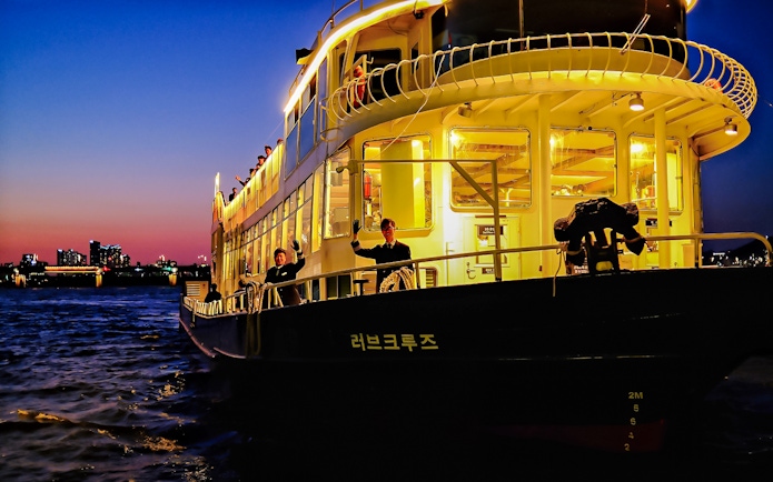 Sunset cruise on Eland Cruise ship with city skyline, Seoul.