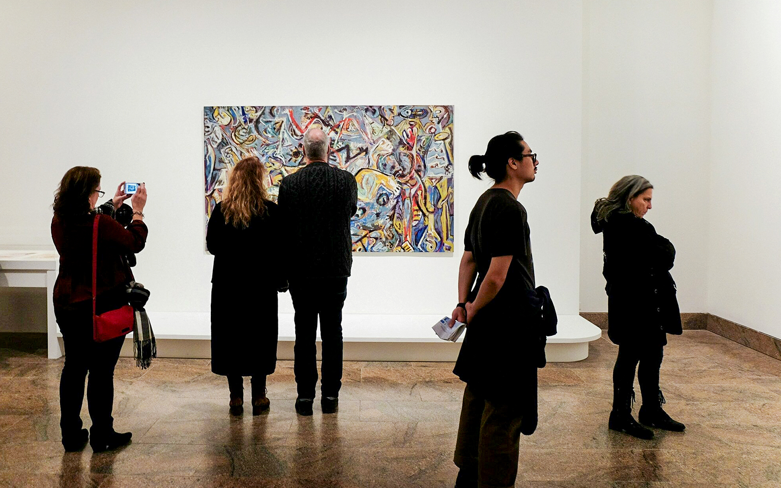 Visitors viewing abstract painting at the Metropolitan Museum.