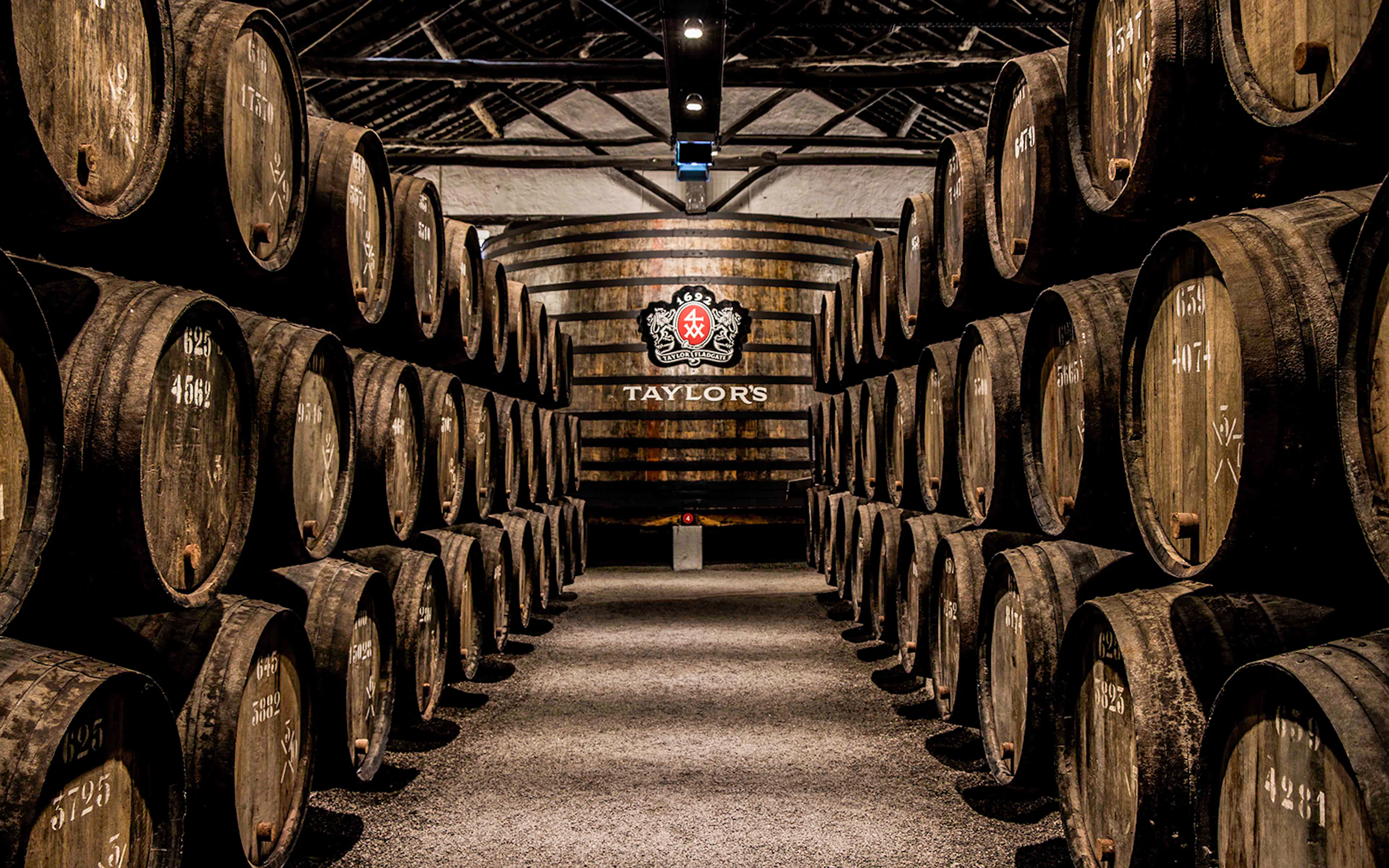 Barrels aging port wine at Taylor's Port Cellars in Porto.