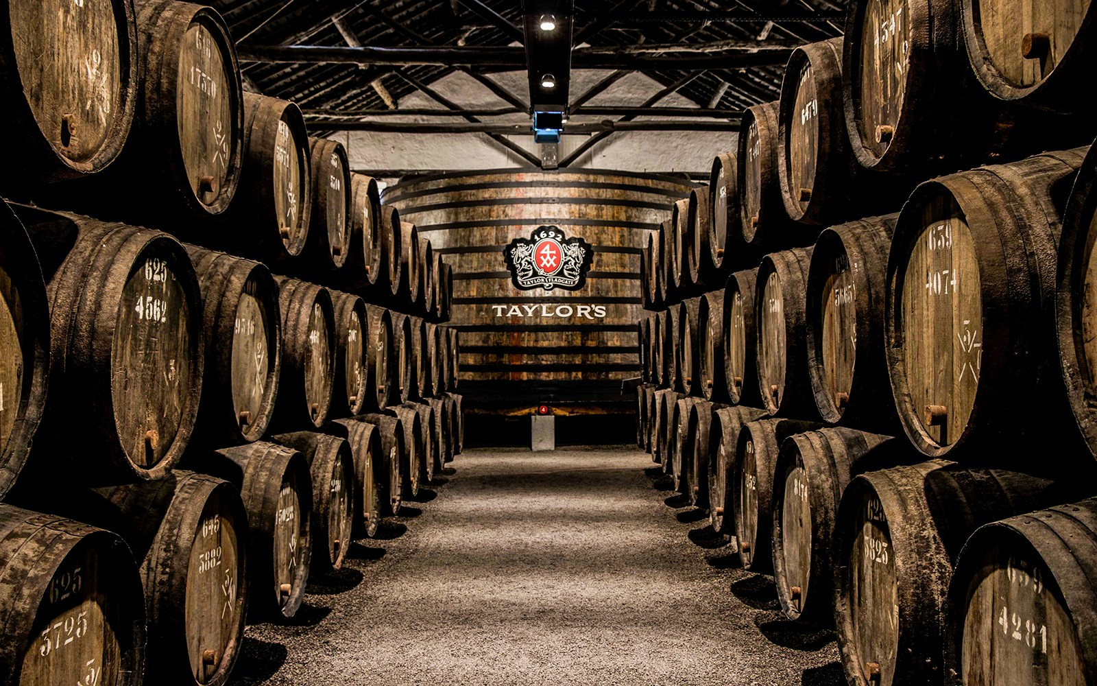 Barrels aging port wine at Taylor's Port Cellars in Porto.