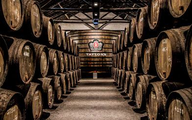 Barrels aging port wine at Taylor's Port Cellars in Porto.