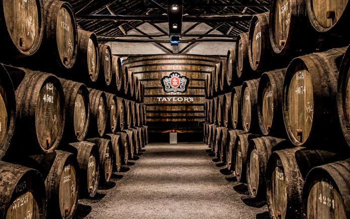 Barrels aging port wine at Taylor's Port Cellars in Porto.