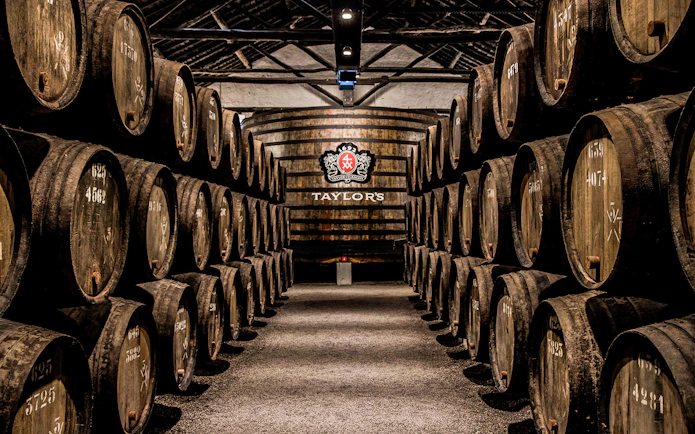 Barrels aging port wine at Taylor's Port Cellars in Porto.