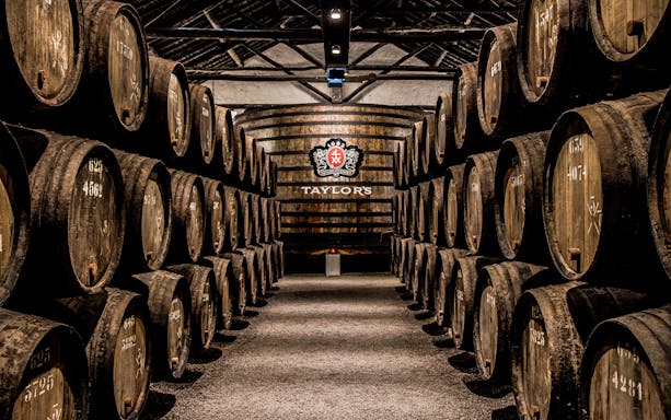 Barrels aging port wine at Taylor's Port Cellars in Porto.