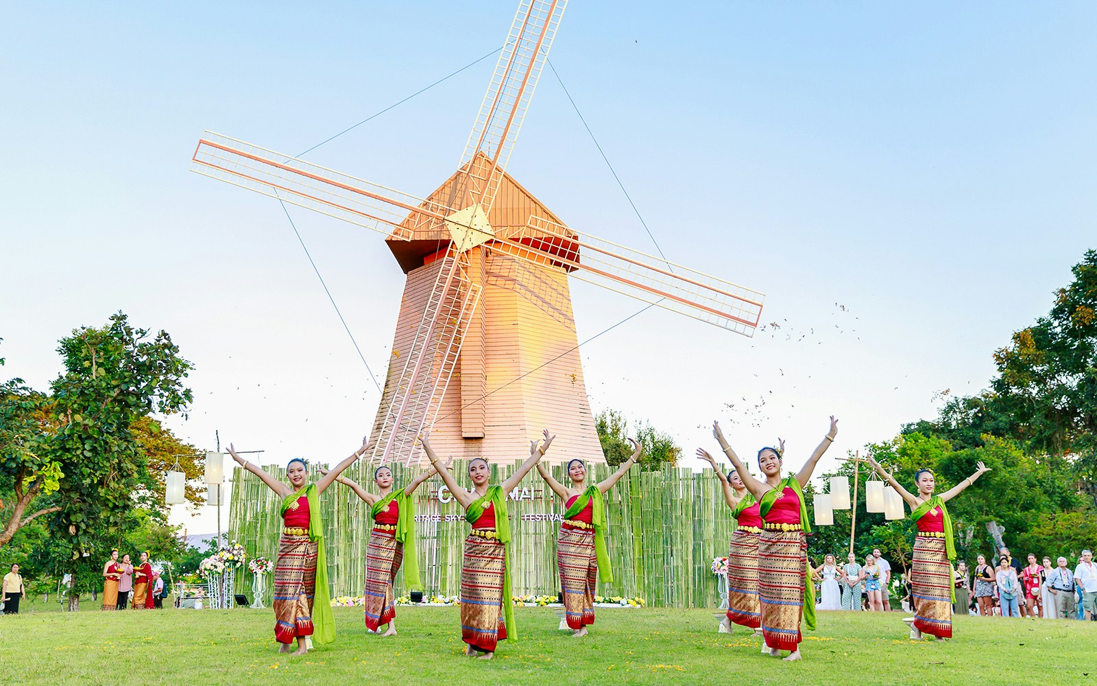 Thai dancers in traditional attire performing at Chiang Mai Sky Lanterns Festival.