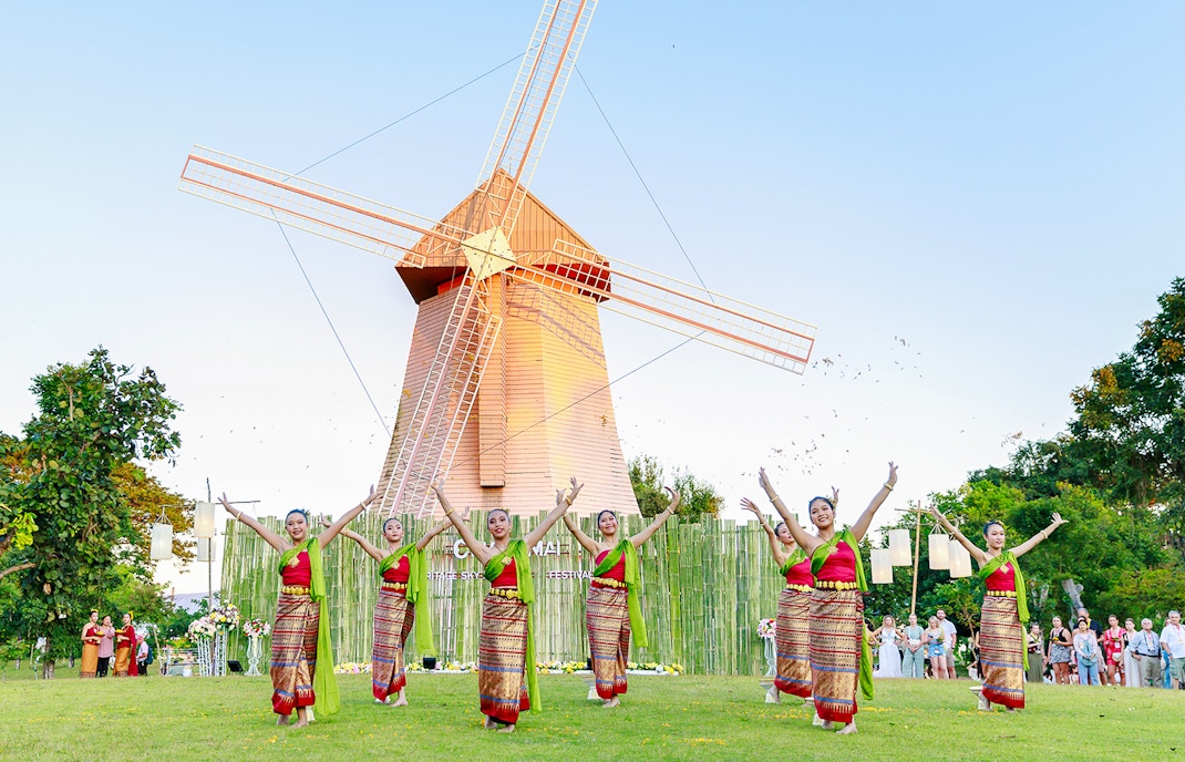 Thai dancers in traditional attire performing at Chiang Mai Sky Lanterns Festival.