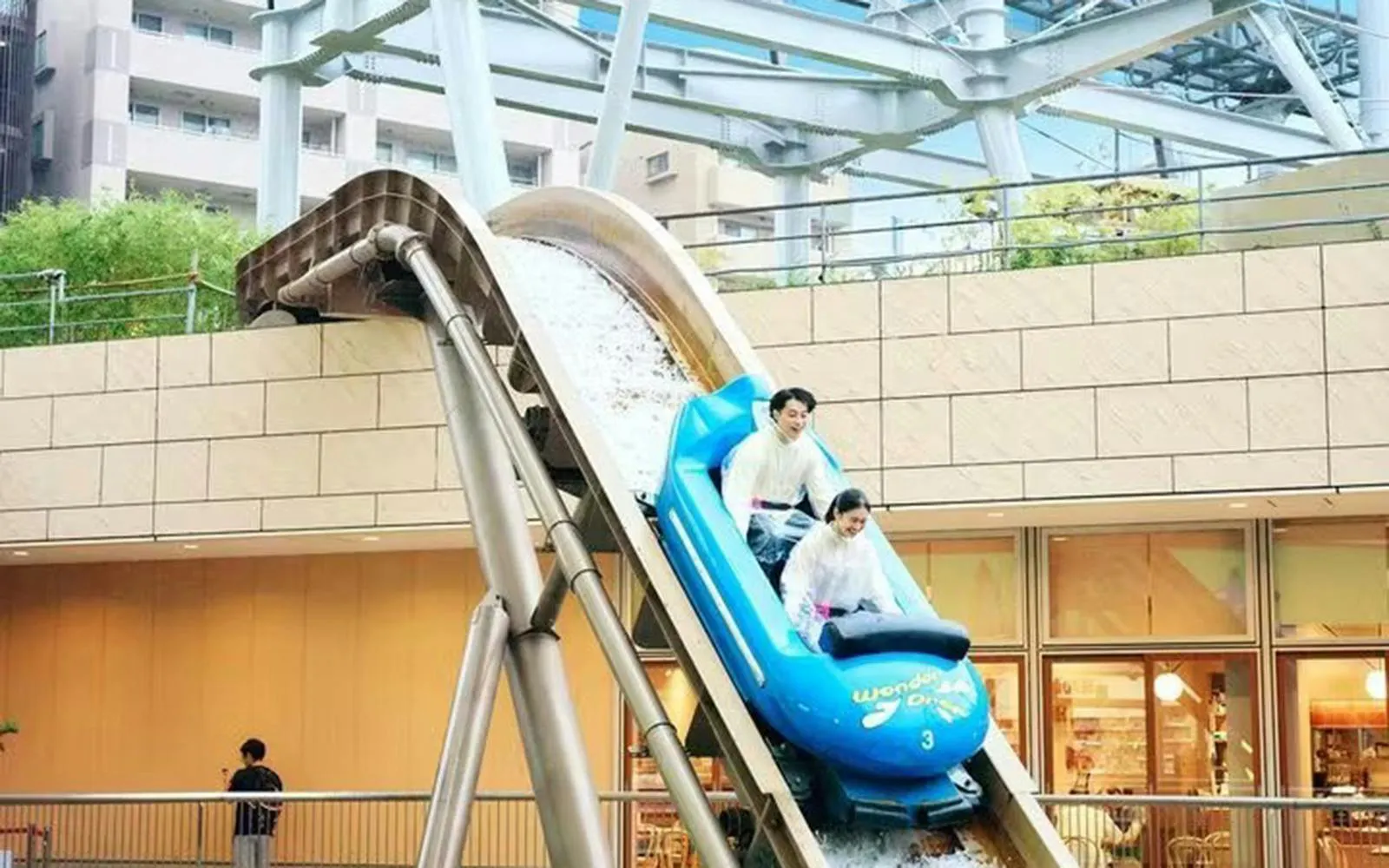 Couple enjoying a water ride at Tokyo Dome City.